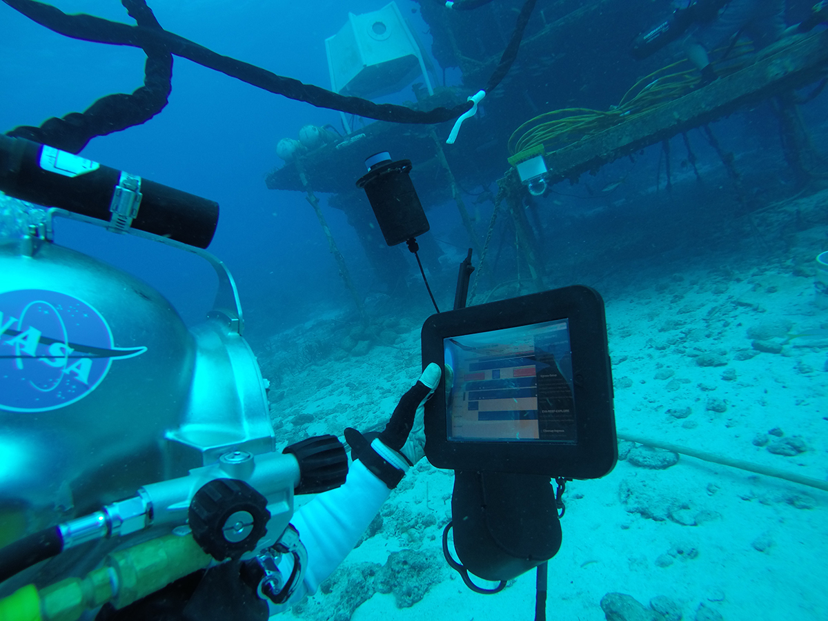 Crew member on NASA Extreme Environment Mission Operations (NEEMO) utilizes Playbook during the undersea mission